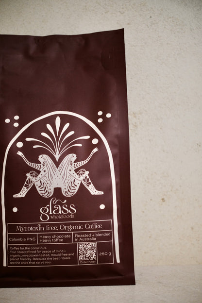 Glass Wholefoods Mycotoxin Free Organic Coffee 250g package with botanical design