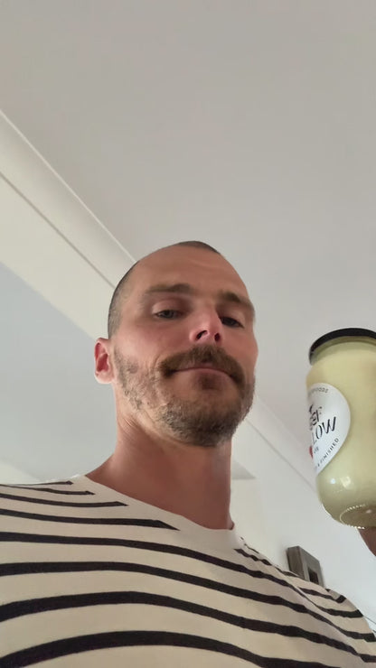Video testimonial featuring Glass Wholefoods founder discussing grass-fed beef tallow with jar visible