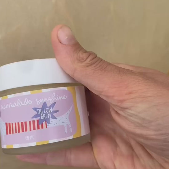Close-up video of Glass Wholefoods Tallow Balm jar showing hand-illustrated label design