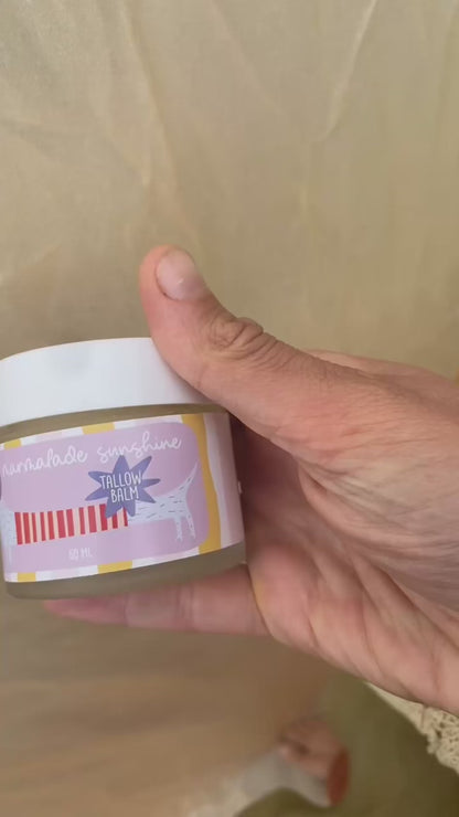 Close-up video of Glass Wholefoods Tallow Balm jar showing hand-illustrated label design