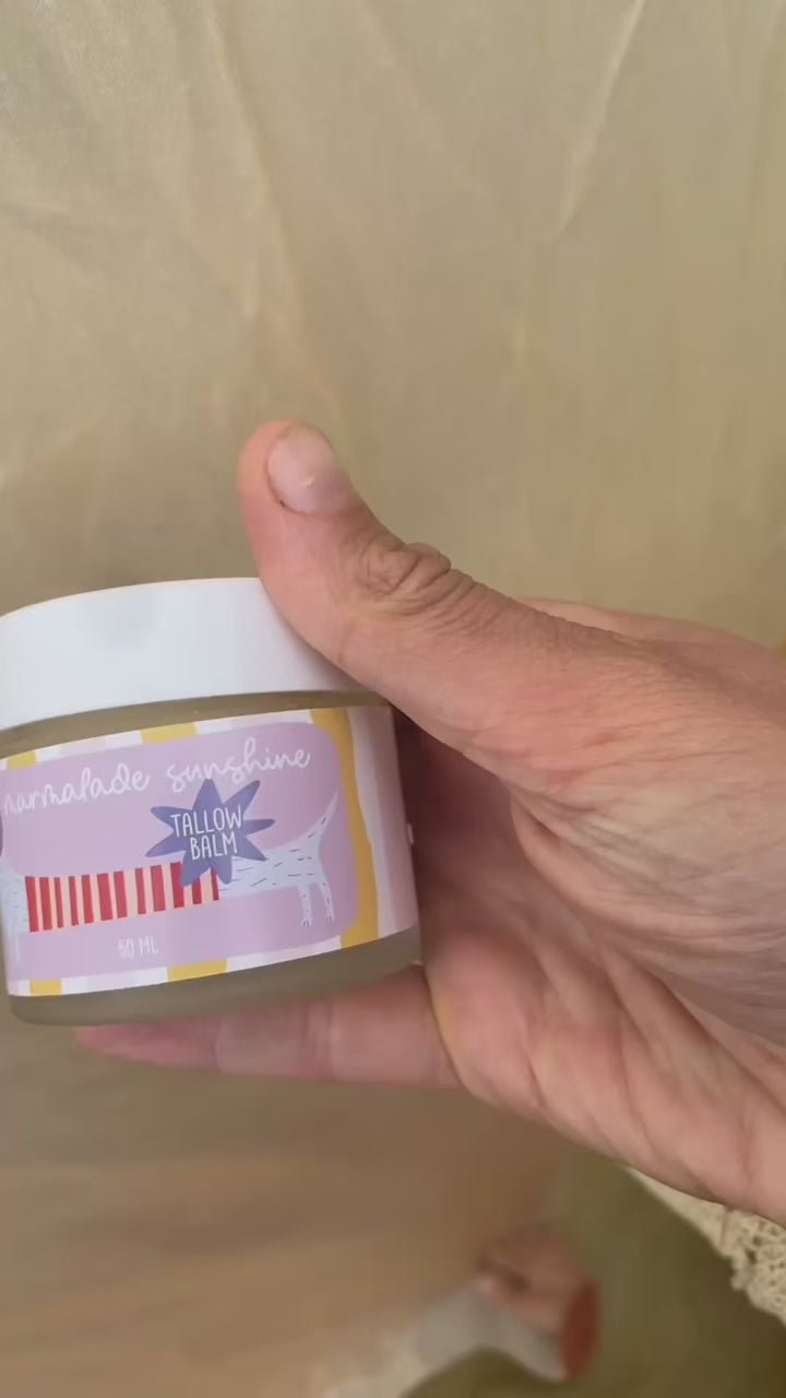 Close-up video of Glass Wholefoods Tallow Balm jar showing hand-illustrated label design
